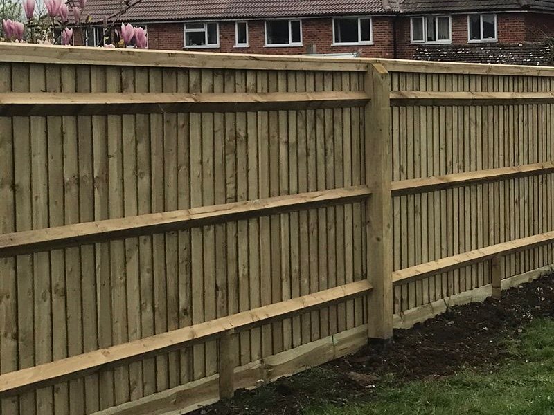 A newly built close-board fence by Family Tree, with posts, rails and gravel boards